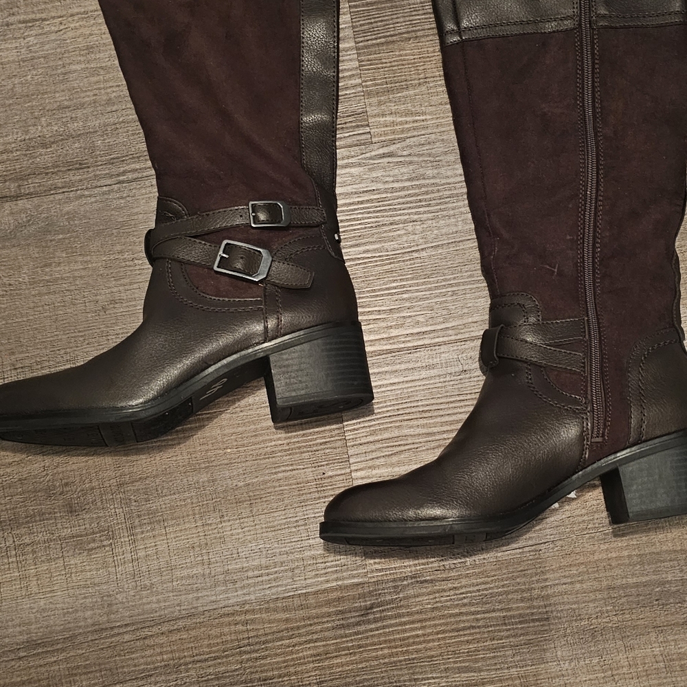 Below the knee dark brown boots.